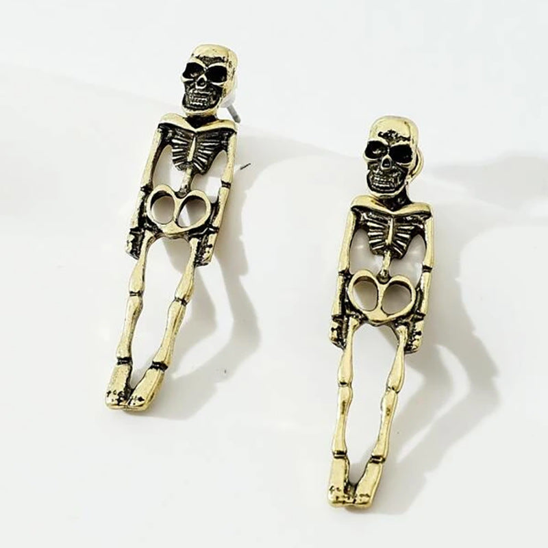Aretes de fantasía fina con forma de esqueletito dorado